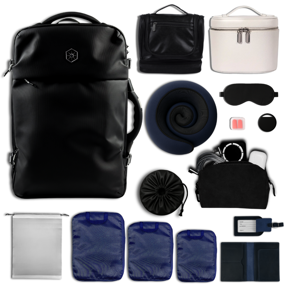 Blue and black themed collection of travel accessories including a black Vaultvac Nomad backpack, neck pillow, sleep mask, and various packing cubes and more products.