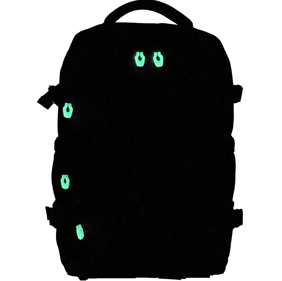 Black VaultVac Scout backpack with green glowing zippers made for night camping